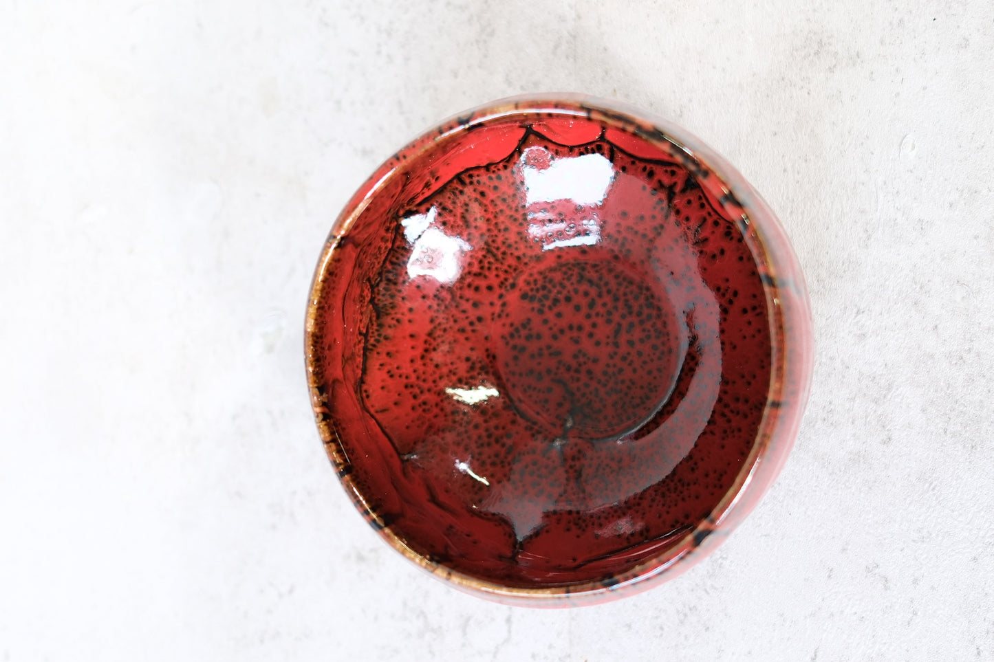 Japanese ceramic bowl with red lava glaze