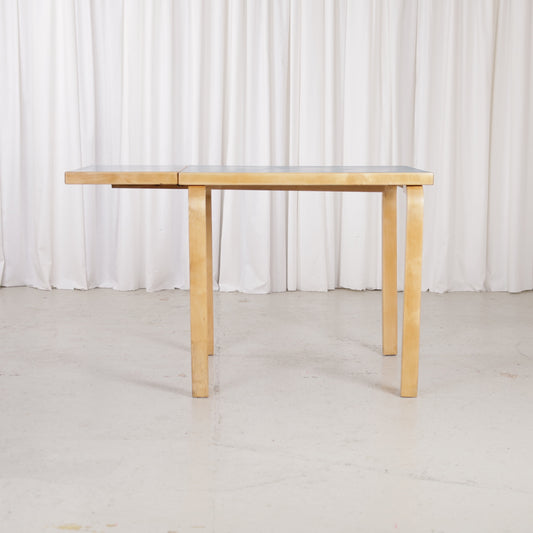 Alvar Aalto DL82 petrol blue linoleum drop-leaf table, front view
