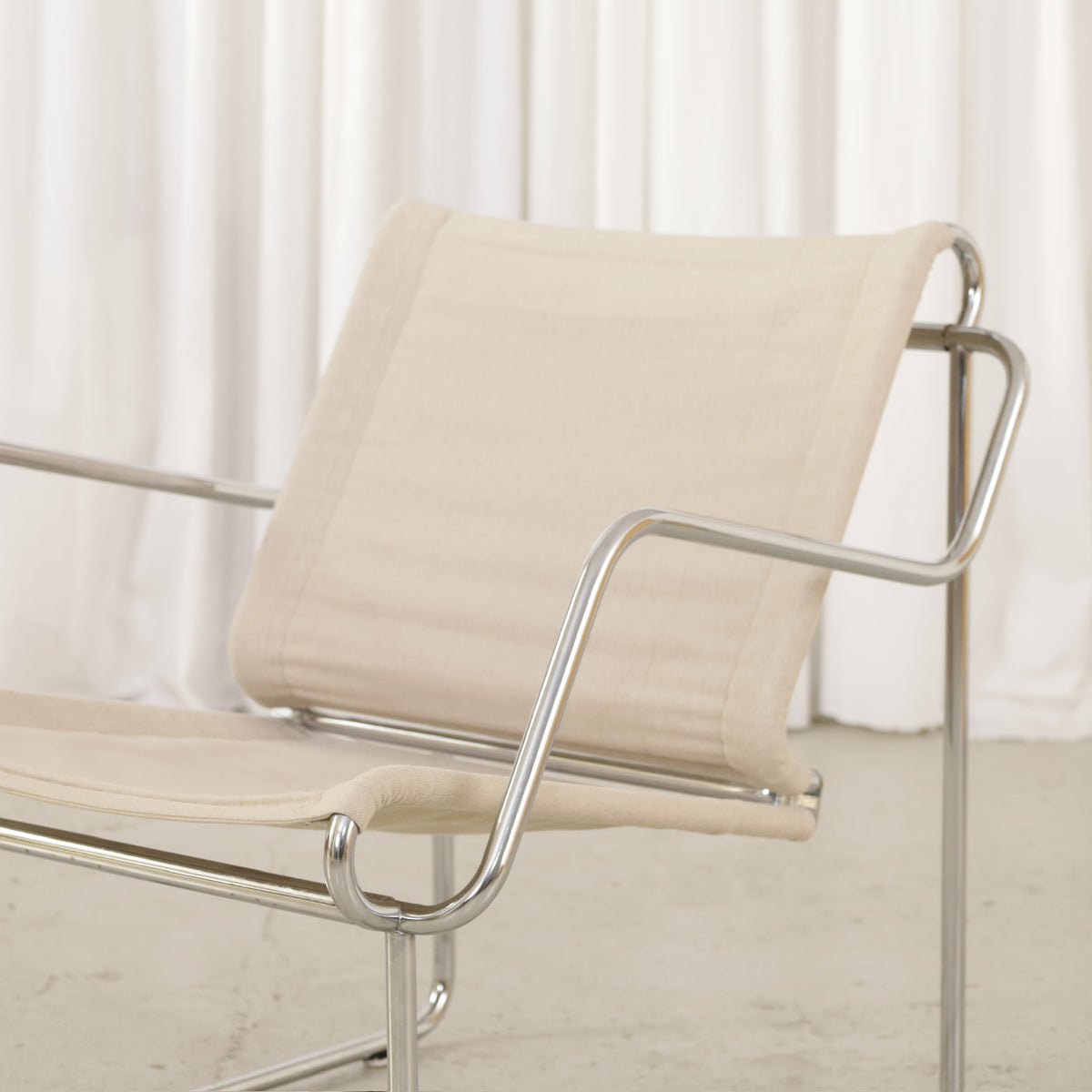 Yrjö Kukkapuro Pressu armchair by Avarte with light linen upholstery and a chrome frame