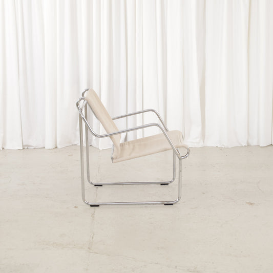 Yrjö Kukkapuro Pressu armchair by Avarte with light linen upholstery and a chrome frame