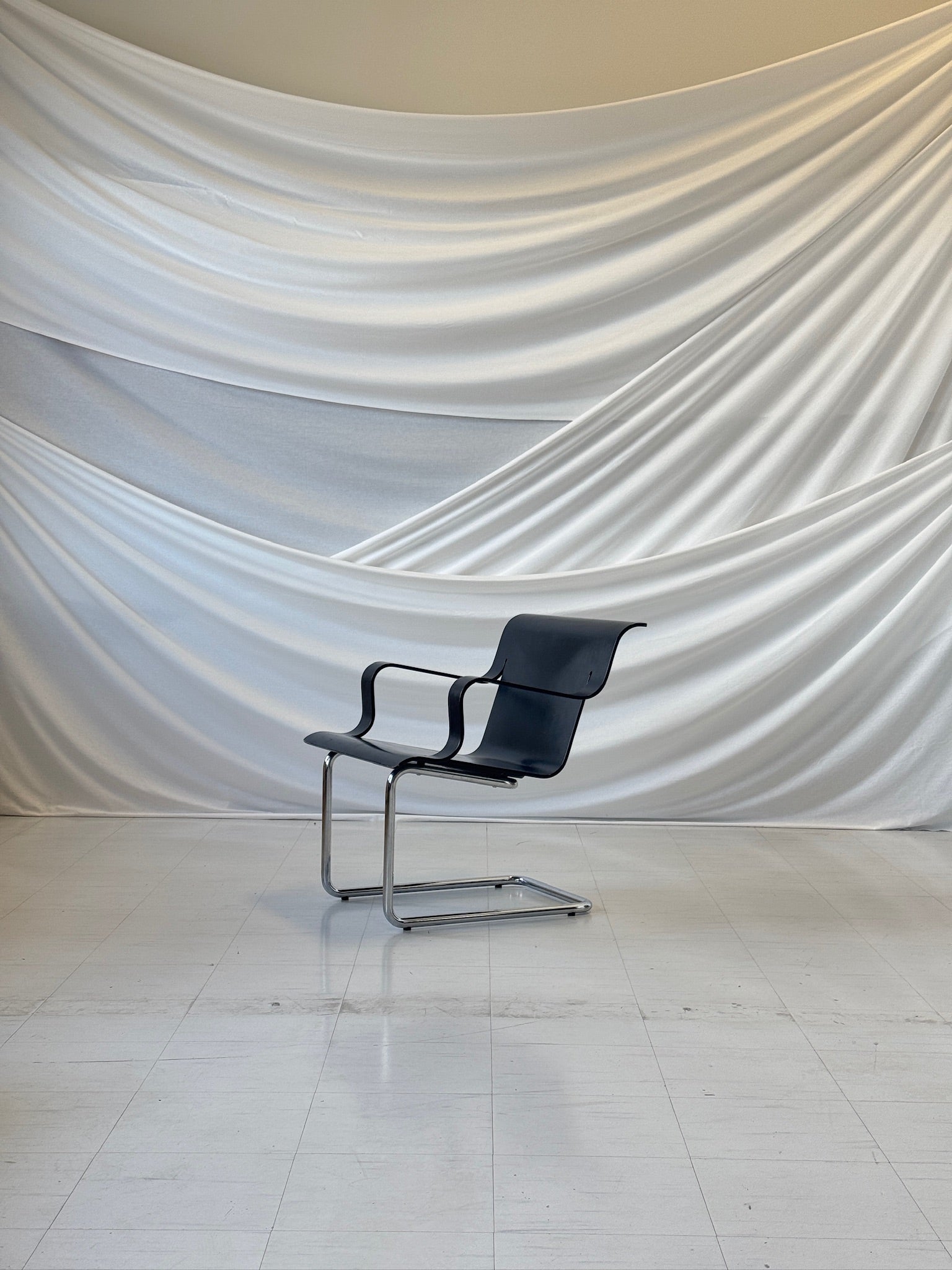 Artek Model 26 chair by Alvar Aalto, black plywood with chrome cantilever base