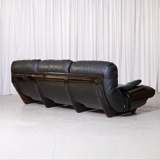 Rear view of three-seat Marsala sofa and curved acrylic shell