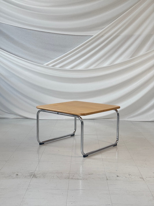 Remmi coffee table by Yrjö Kukkapuro with bent chrome tubular frame and birch veneer top, designed for Avarte, Finland.