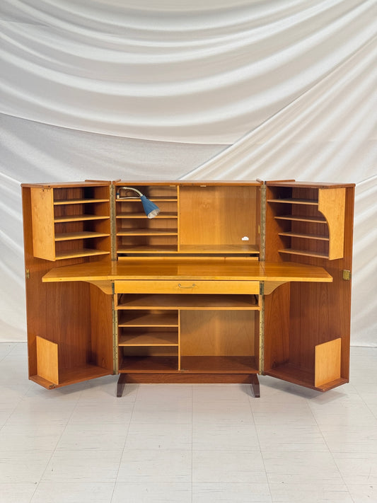 1950s compact teak and birch folding desk cabinet with integrated lamp, shelves, and drawers, shown open and closed