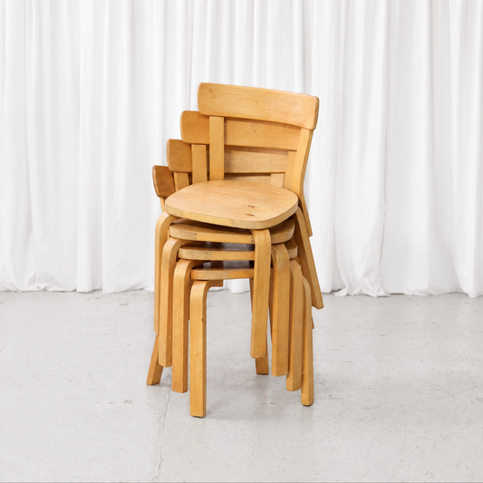 Four 1950s Artek Chair 69 chairs stacked together
