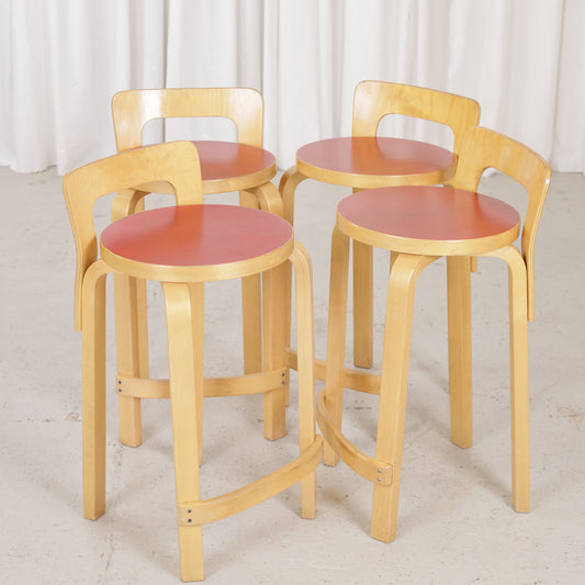 Alvar Aalto K65 high chair for Artek in patinated birch with a red linoleum seat