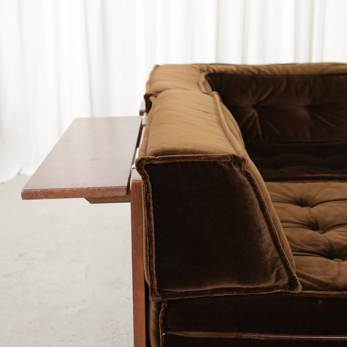 Movable wooden armrest attached to the sofa
