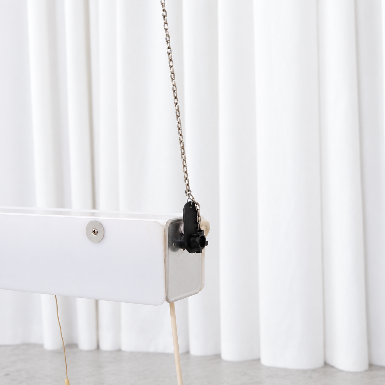 Detail of the pendant light end fitting, suspension chain and cable