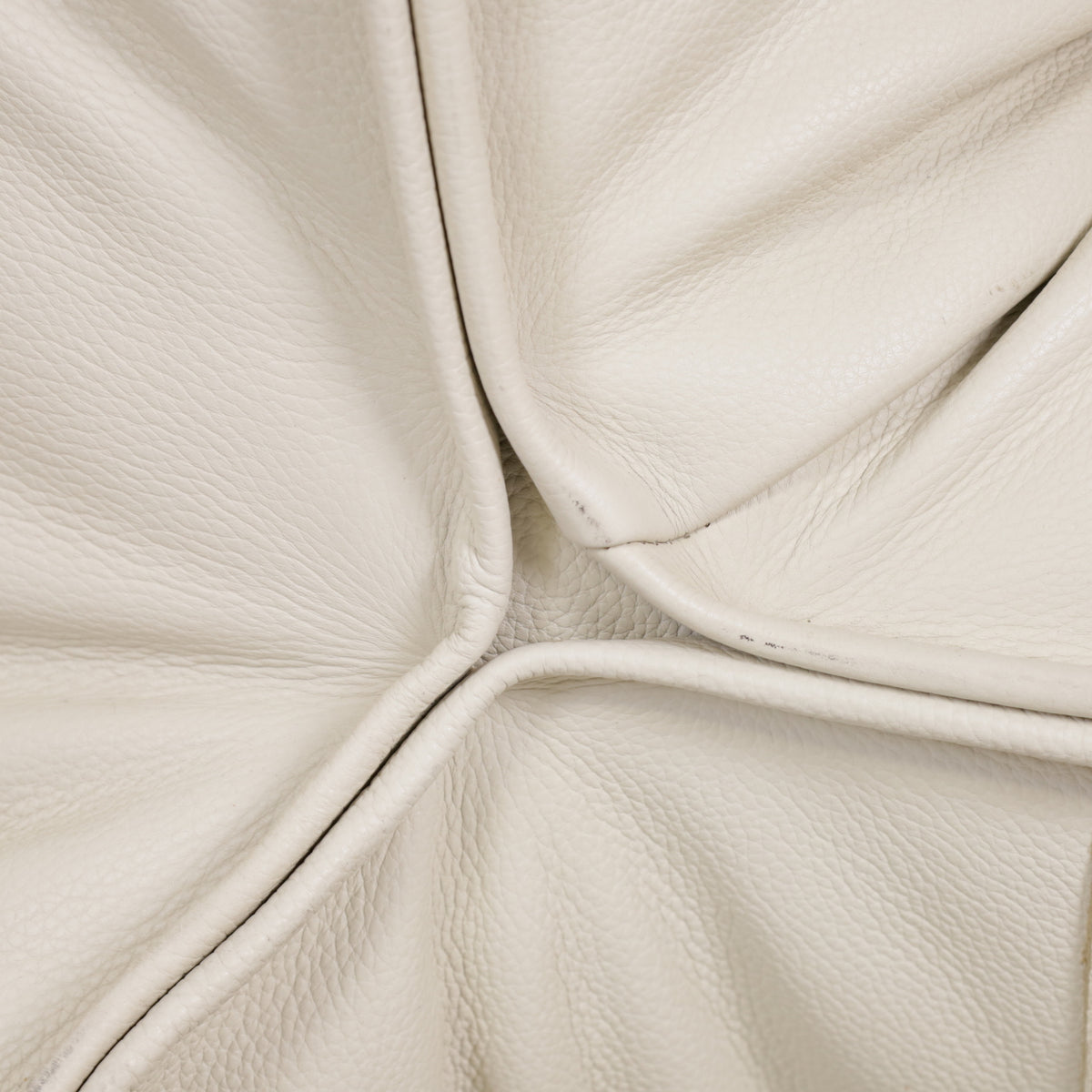 Close-up of Yoko leather upholstery and stitched piping