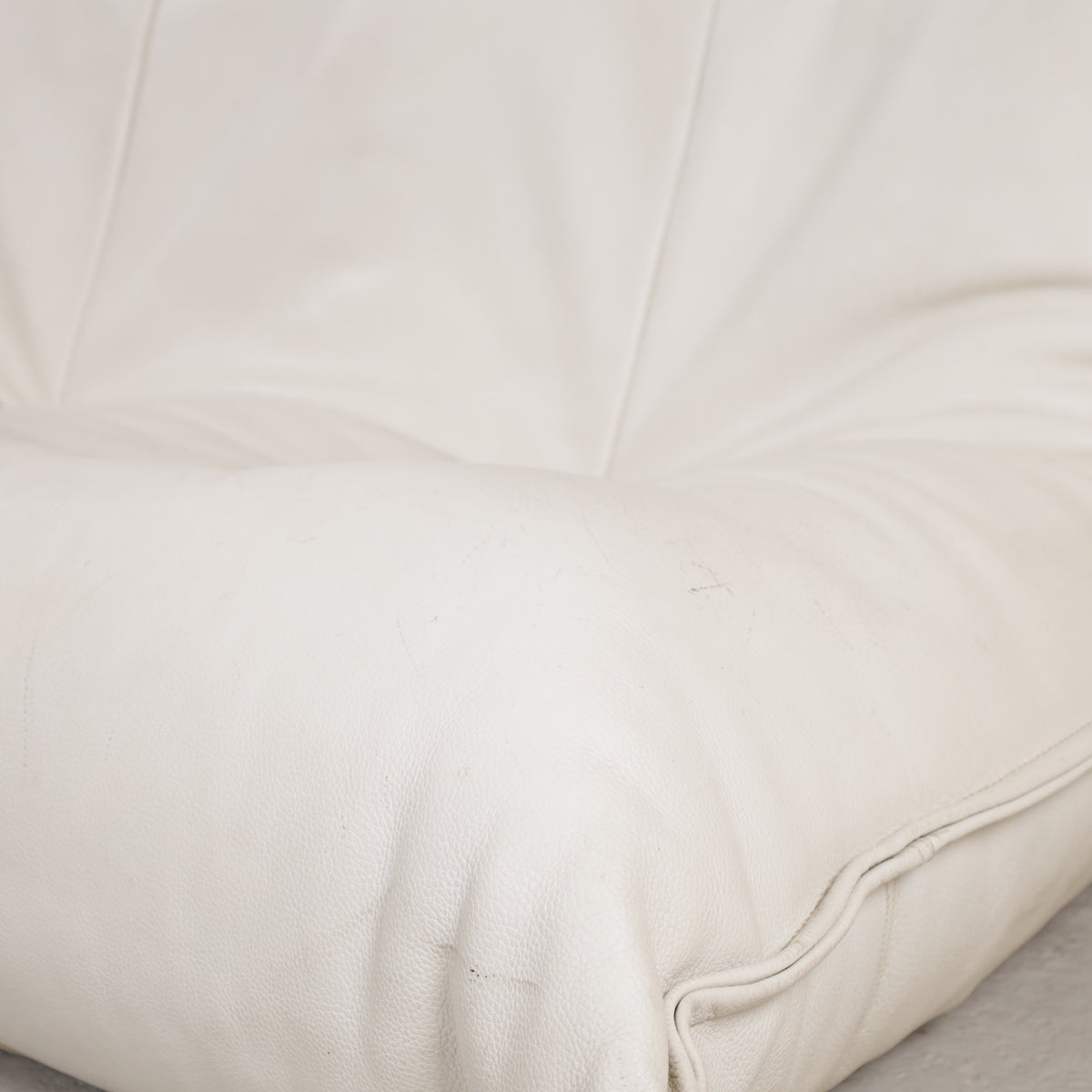 Seat and backrest detail of cream leather Yoko sofa