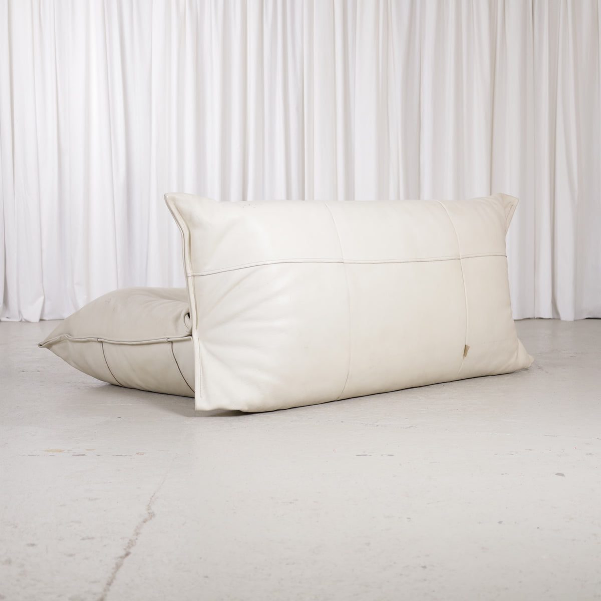 Yoko sofa in cream leather, rear three-quarter view