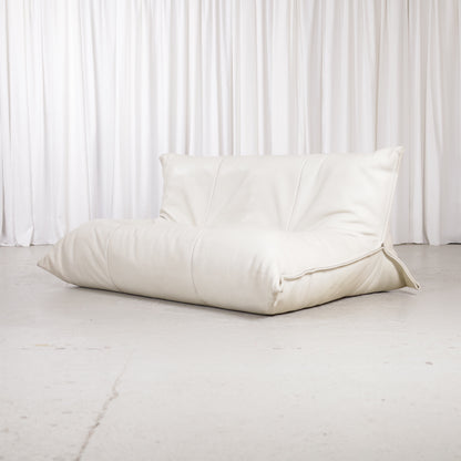 Ligne Roset Yoko two-seater sofa in cream leather, front three-quarter view