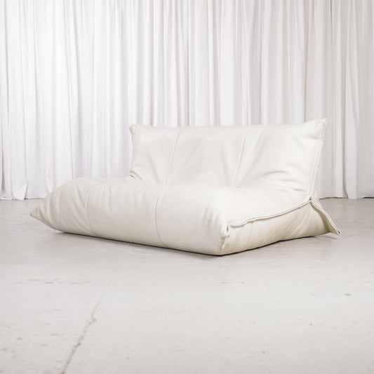 Ligne Roset Yoko two-seater sofa in cream leather, front three-quarter view