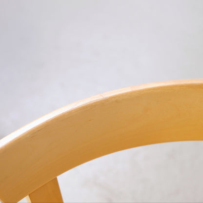 Detail of light wear on the birch backrest of Chair 69