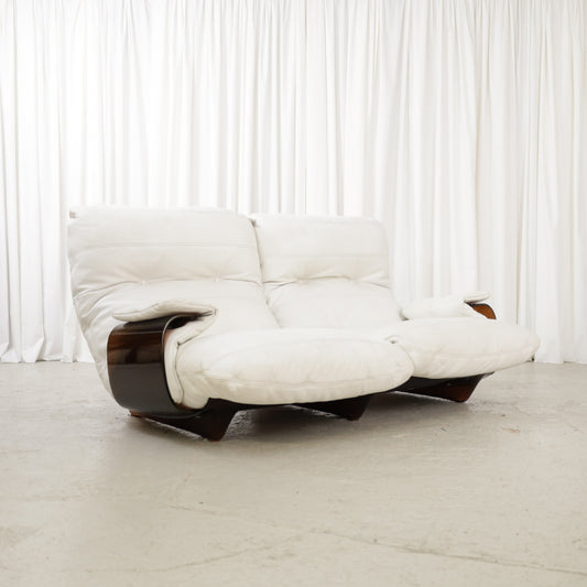 Low front angled view of the white sofa with brown shell