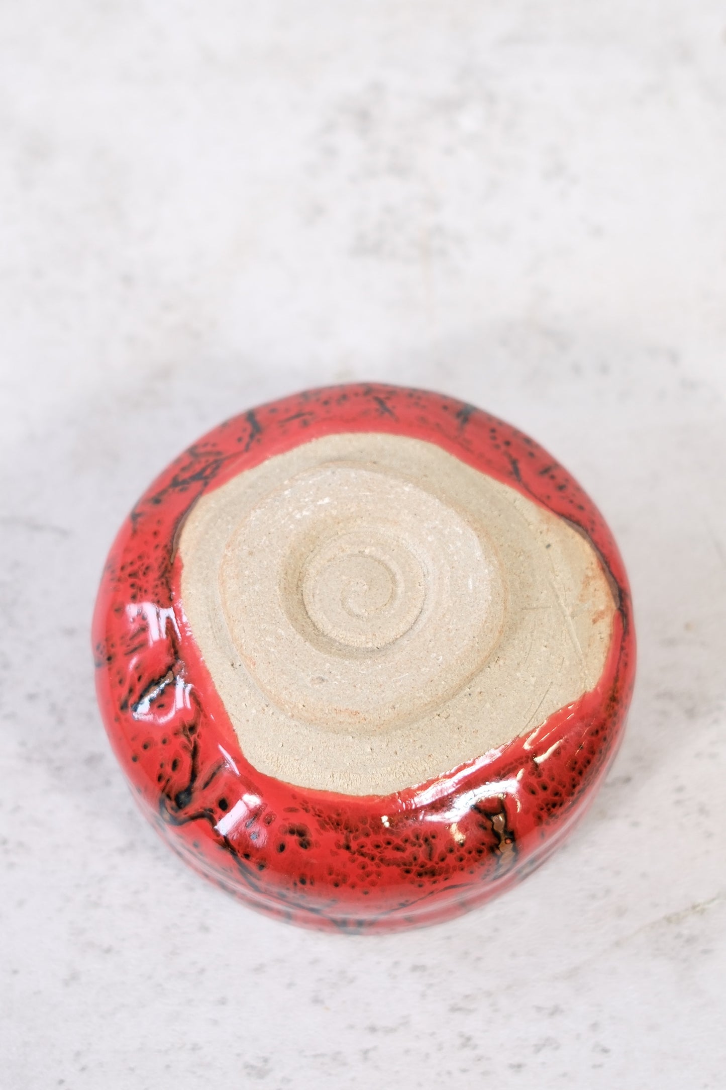 Japanese ceramic bowl with red lava glaze