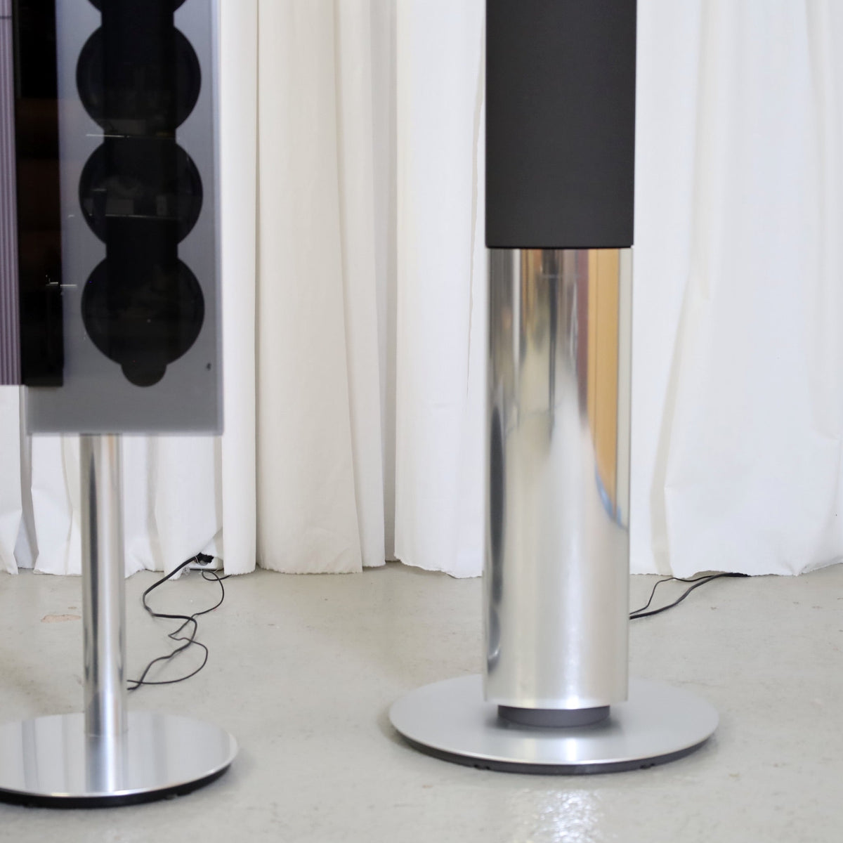 Detail of a silver and black BeoLab 1 active loudspeaker