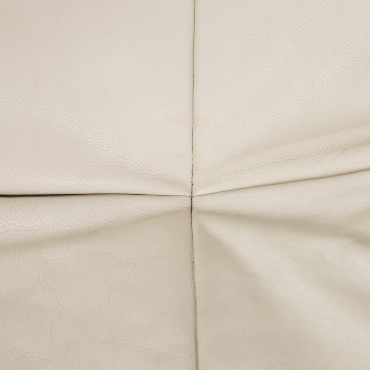 Rear leather seams and folds on Yoko sofa