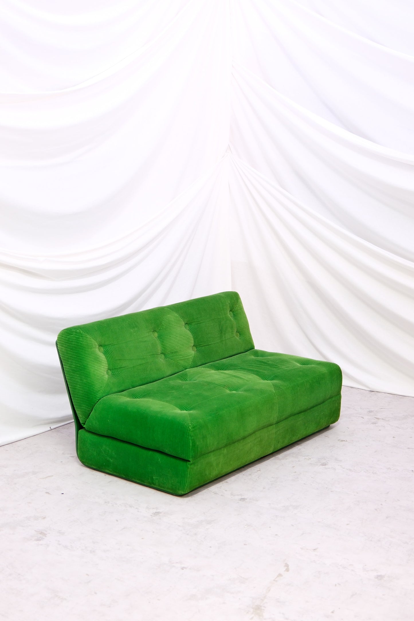 Vintage Easy sofa bed designed by Ahti Taskinen and produced by Inno. Green corduroy upholstery with sleeping function. Worldwide shipping available.