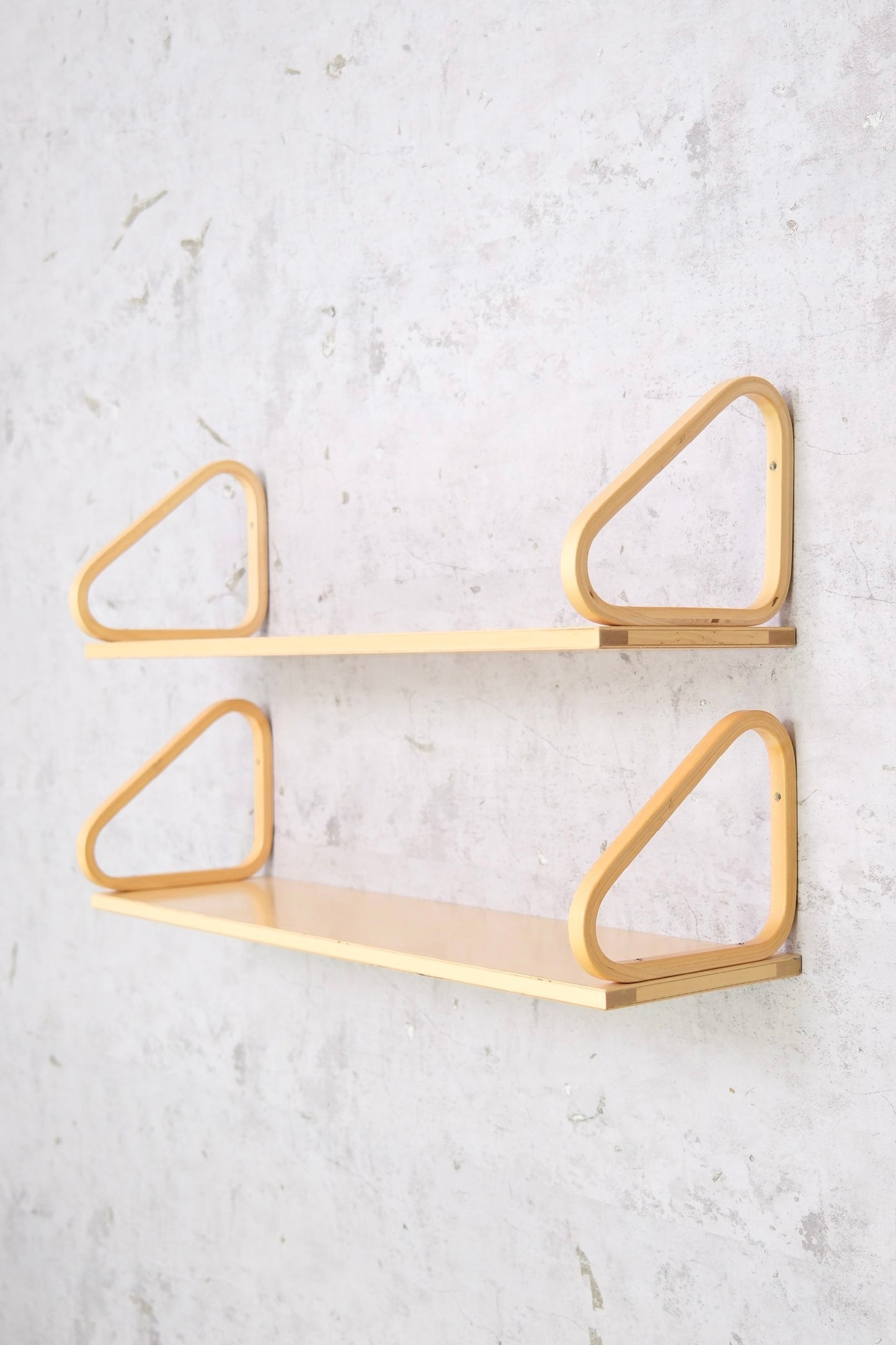 Pair of original Alvar Aalto 112B wall shelves for Artek. Fair vintage condition with surface wear, structurally solid. Photos show details. Worldwide shipping.