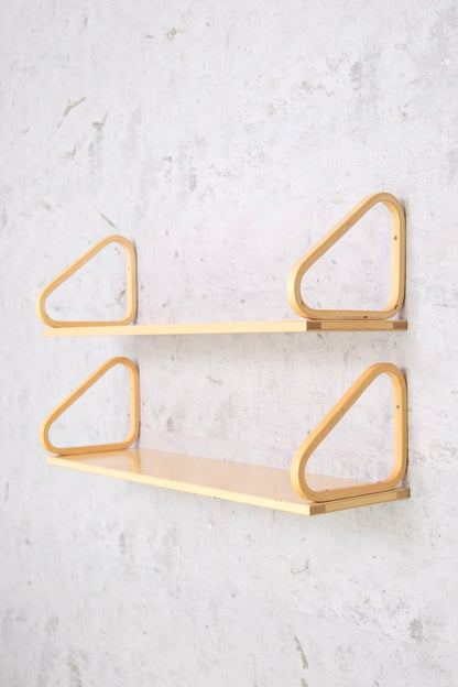 Pair of original Alvar Aalto 112B wall shelves for Artek. Fair vintage condition with surface wear, structurally solid. Photos show details. Worldwide shipping.