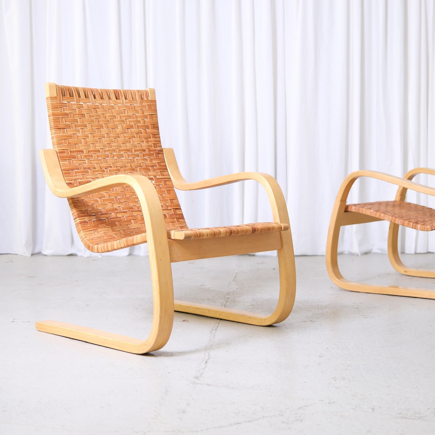 alvar-aalto-406-rattan-lounge-chairs-artek