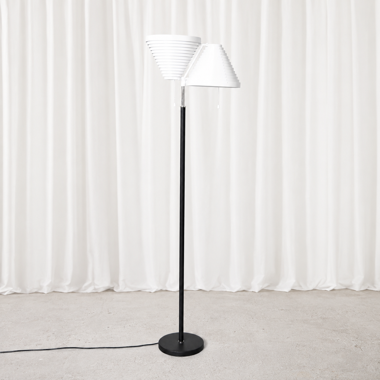 Vintage Alvar Aalto A810 floor lamp for Artek with polished stainless steel details. An iconic Finnish lighting design originally created in 1959.