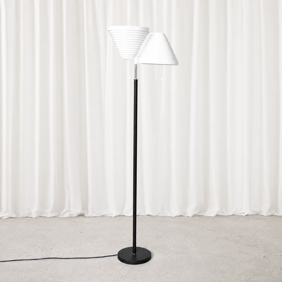 Vintage Alvar Aalto A810 floor lamp for Artek with polished stainless steel details. An iconic Finnish lighting design originally created in 1959.