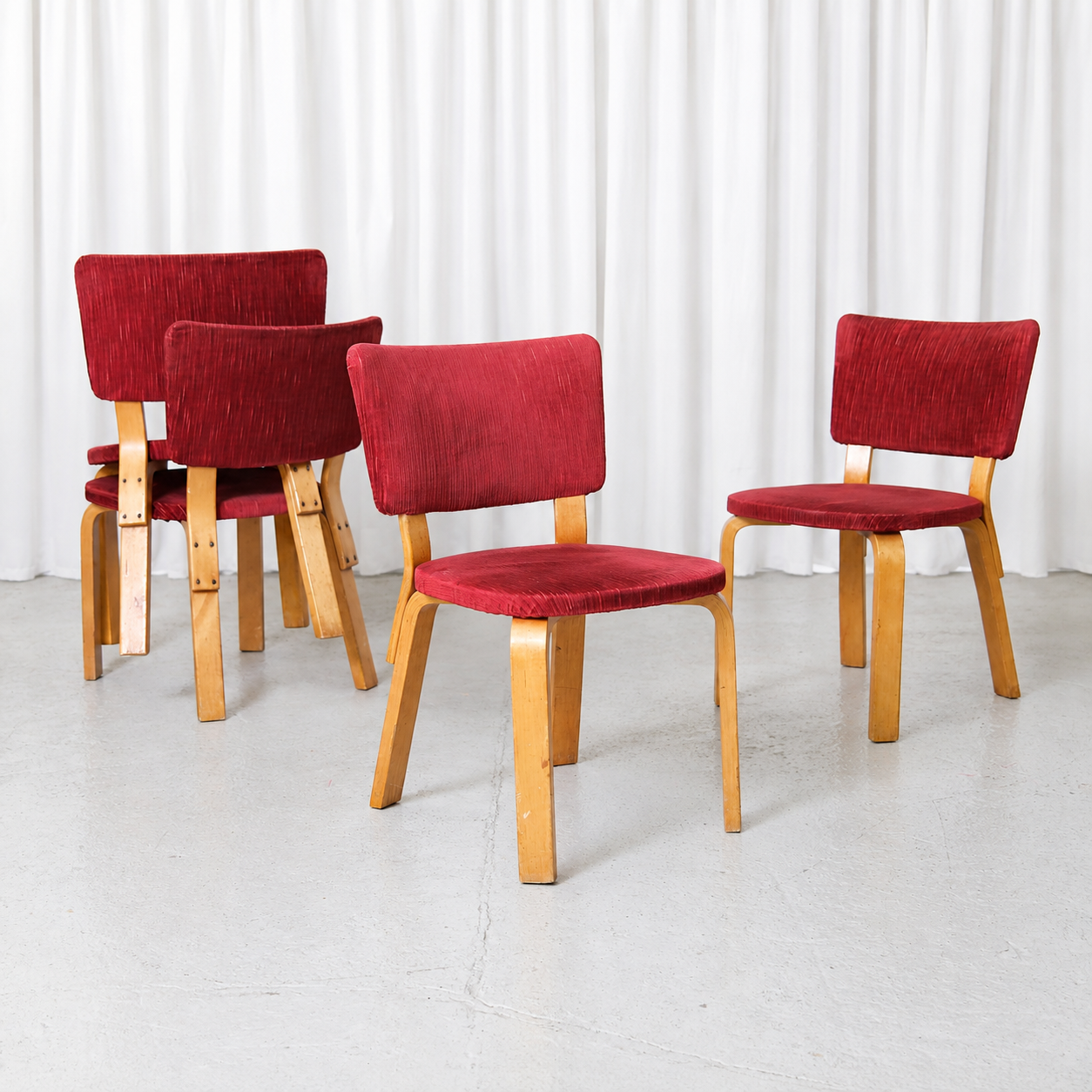 Vintage Alvar Aalto Chair 62 for Artek with a birch frame and deep red fabric upholstery. Beautiful patina and good vintage condition.