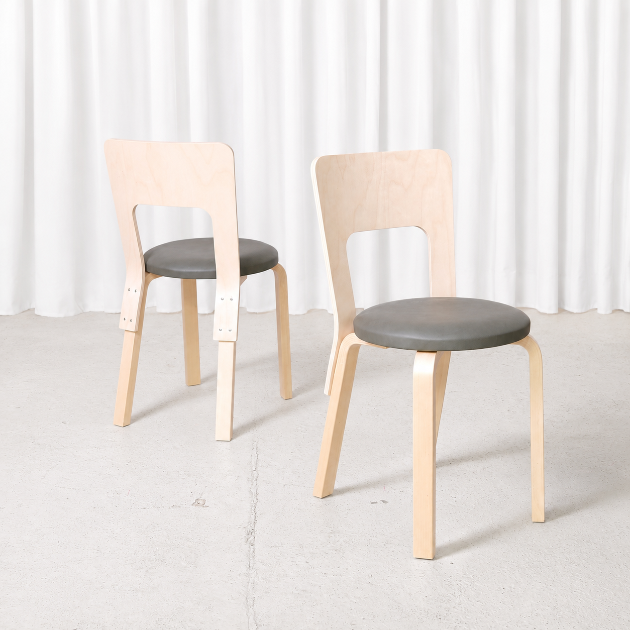 Alvar Aalto Chair 66 for Artek in natural birch with a dark grey upholstered seat. Manufactured in 2026 and in like-new condition. Sold individually.