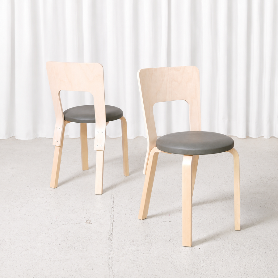 Alvar Aalto Chair 66 for Artek in natural birch with a dark grey upholstered seat. Manufactured in 2026 and in like-new condition. Sold individually.