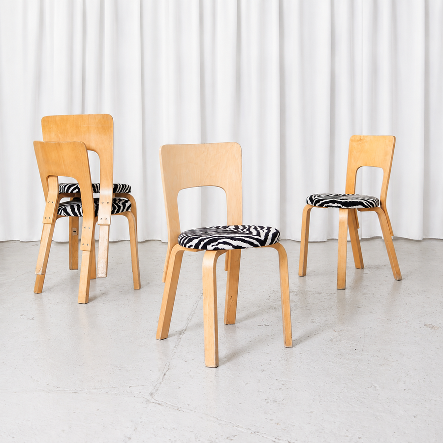 Vintage Artek Chair 66 by Alvar Aalto in birch with black-and-white Zebra upholstery. Beautiful patina, visible wear and a sturdy overall condition.
