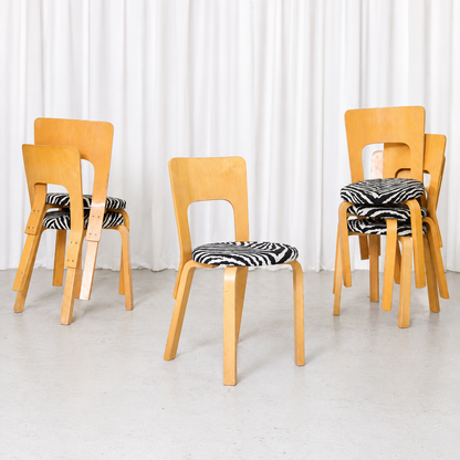 Vintage Artek Chair 66 designed by Alvar Aalto in birch with graphic black-and-white zebra upholstery and naturally developed vintage patina