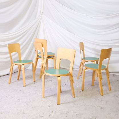 Vintage Alvar Aalto Chair 66 by Artek from 1998 with natural birch frame and green linoleum seat. Good vintage condition. Available individually.