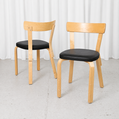 Vintage Alvar Aalto Chair 69 for Artek in natural birch with black upholstery. Good vintage condition with attractive patina. Sold individually.