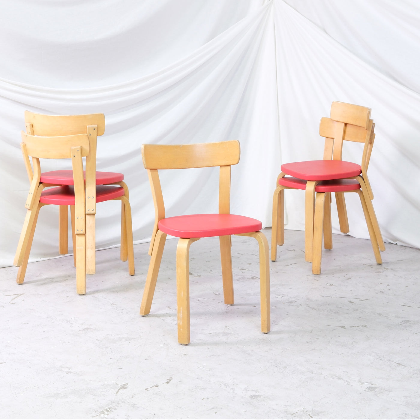 Vintage Alvar Aalto Chair 69 by Artek with birch frame and red upholstery. Good vintage condition with signs of use. Worldwide shipping available.