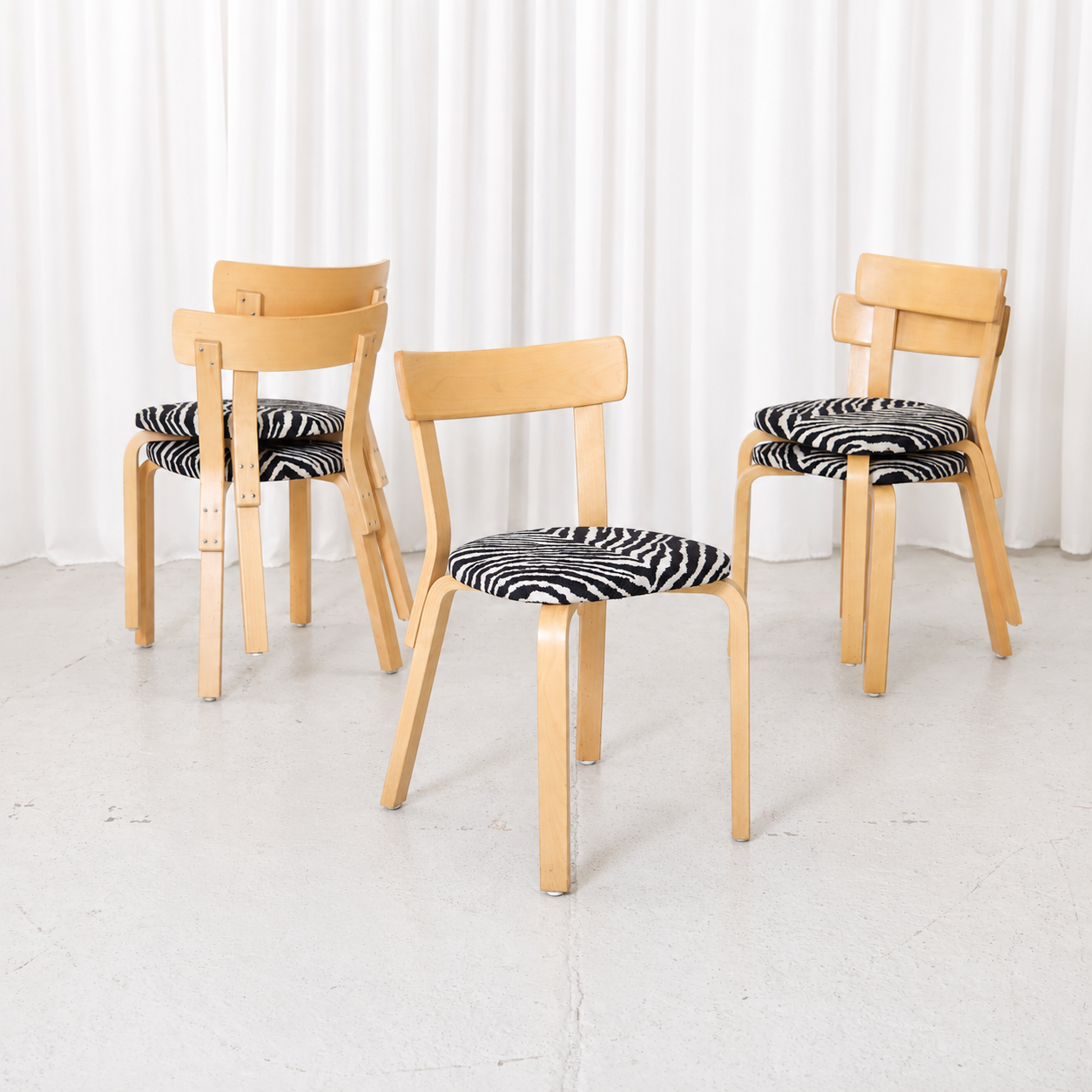 Vintage Alvar Aalto Chair 69 for Artek in birch with black-and-white Zebra upholstery and beautiful natural patina. Sold individually.