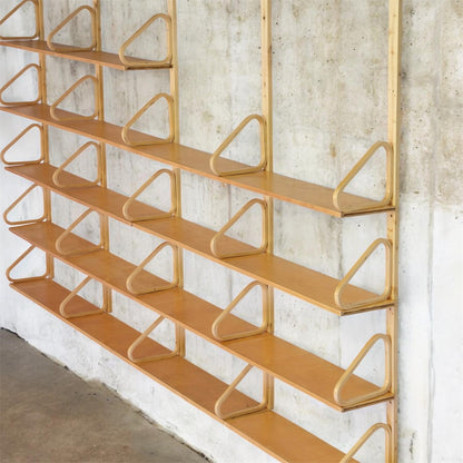 One of one custom Alvar Aalto Artek wall shelf in birch with adjustable shelves and bentwood brackets