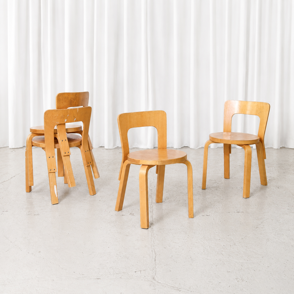 Vintage Artek N65 children’s chair designed by Alvar Aalto in birch. Beautifully aged examples with visible wear, surface marks and authentic patina.