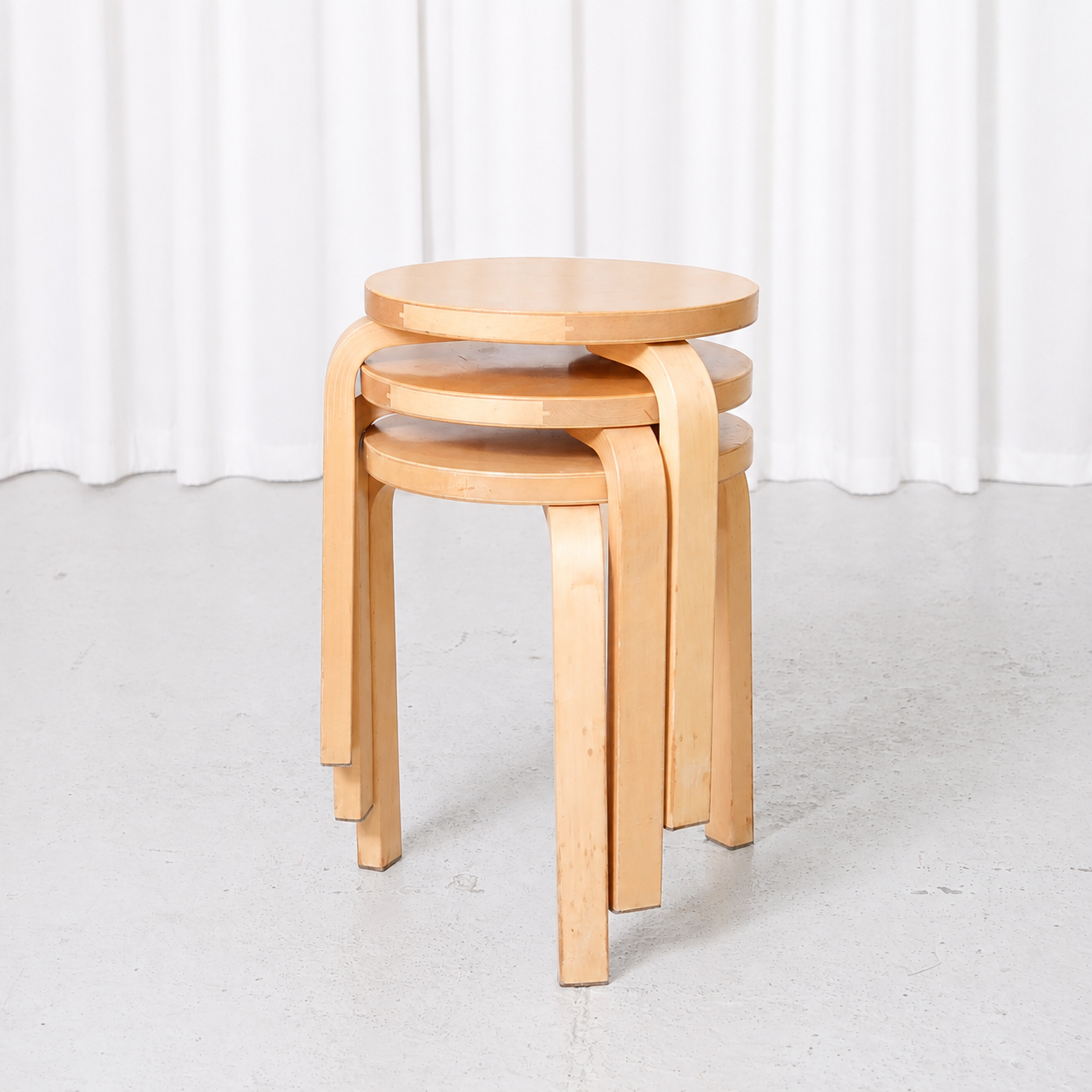 Vintage Alvar Aalto Stool 60 for Artek from the 1960s, featuring an early finger-jointed seat edge, aged birch surfaces and beautiful natural patina.