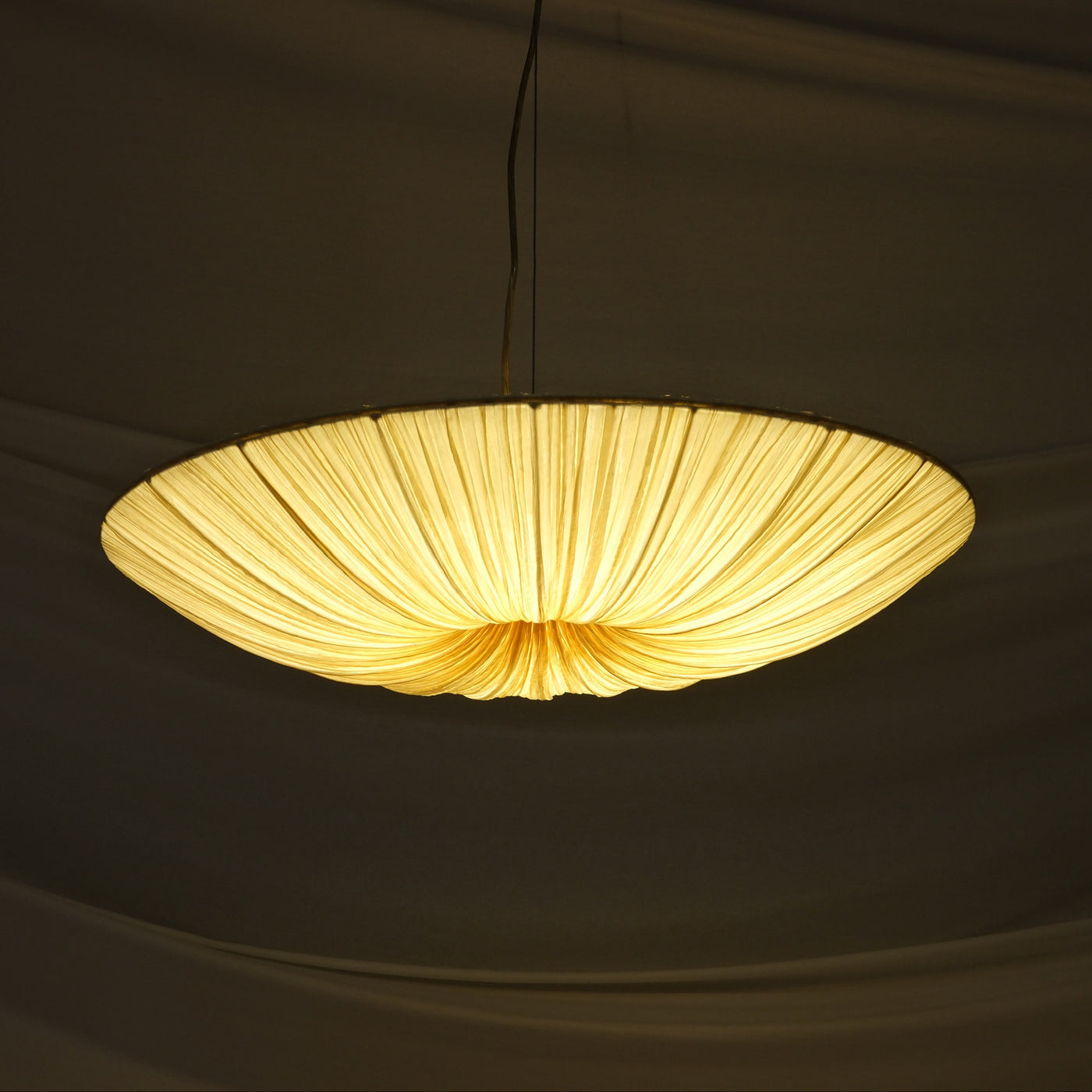 Aqua Creations Stand By Pendant Light 76 cm in crushed silk and metal. Handcrafted designer pendant with soft diffused light. Worldwide shipping from Helsinki.