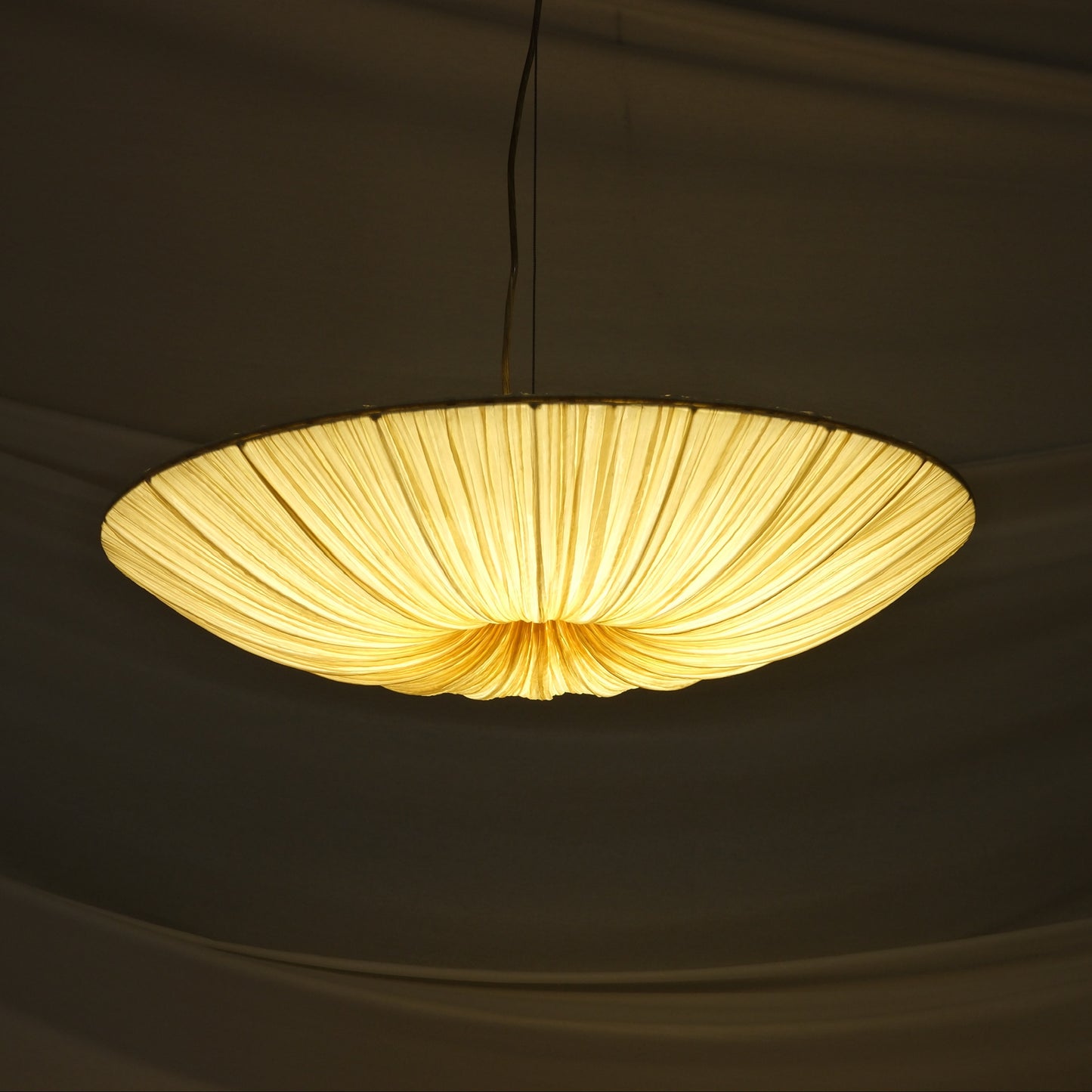 Aqua Creations Stand By Pendant Light 76 cm in crushed silk and metal. Handcrafted designer pendant with soft diffused light. Worldwide shipping from Helsinki.