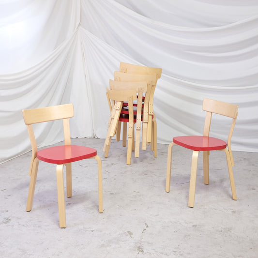 Artek Chair 69 designed by Alvar Aalto with birch frame and red seat. Produced in 2021 and in very good condition. Worldwide shipping available.
