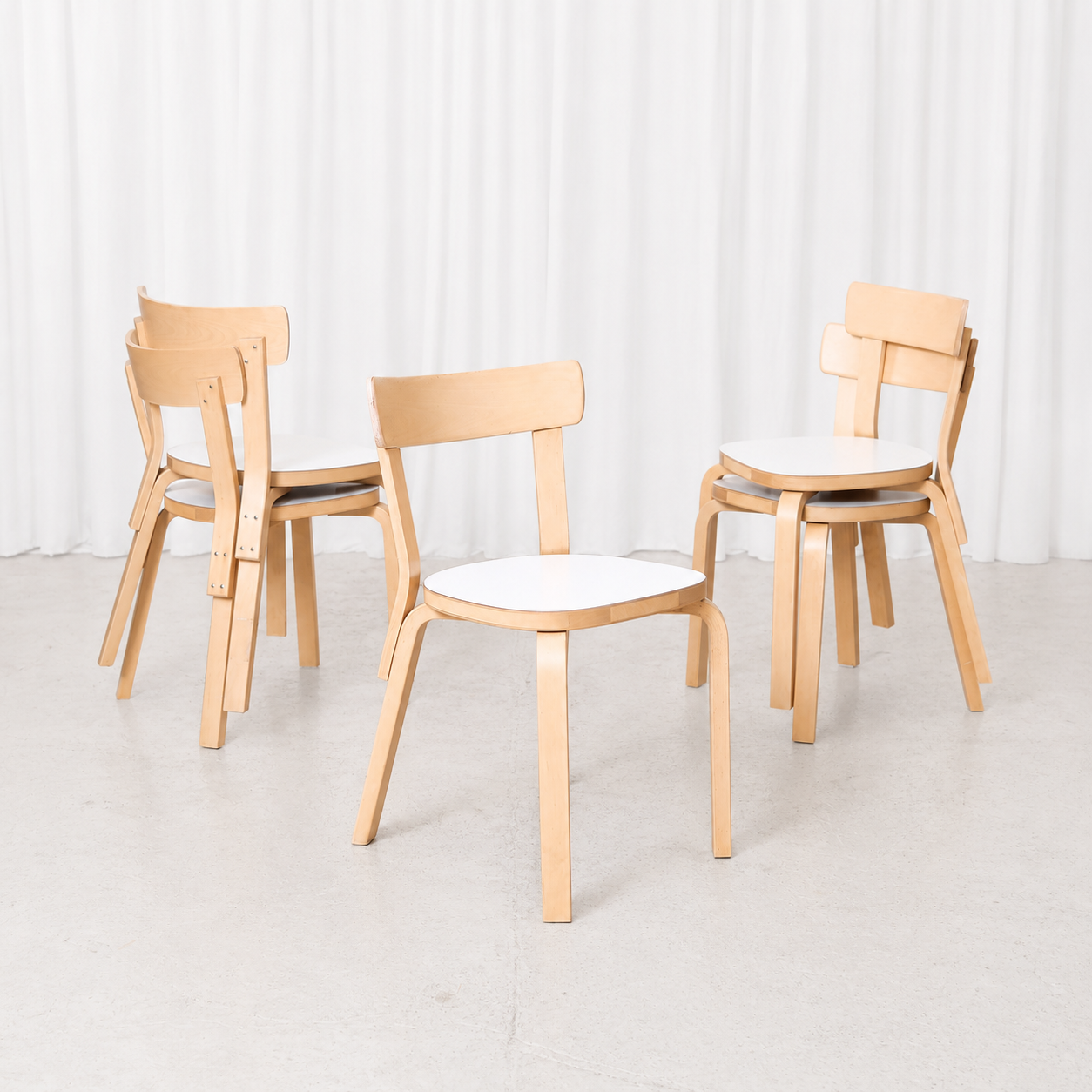 Vintage Artek Chair 69 by Alvar Aalto in birch with a white laminate seat. Good vintage condition with minor wear to the backrest.