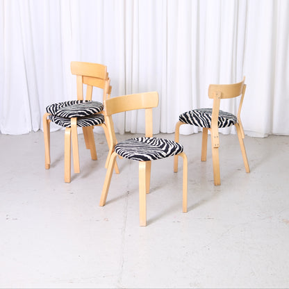 Artek Chair 69 by Alvar Aalto with birch frame and zebra-patterned upholstery, vintage Finnish design dining chair.