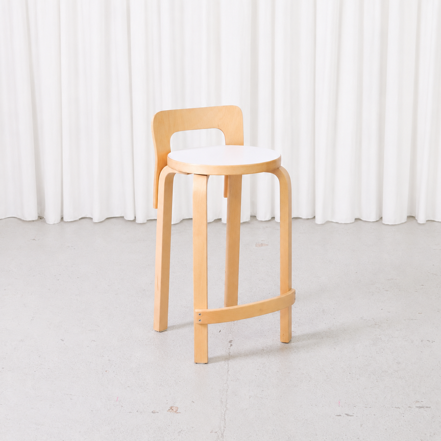 Artek K65 bar stool by Alvar Aalto with birch frame and white laminate seat