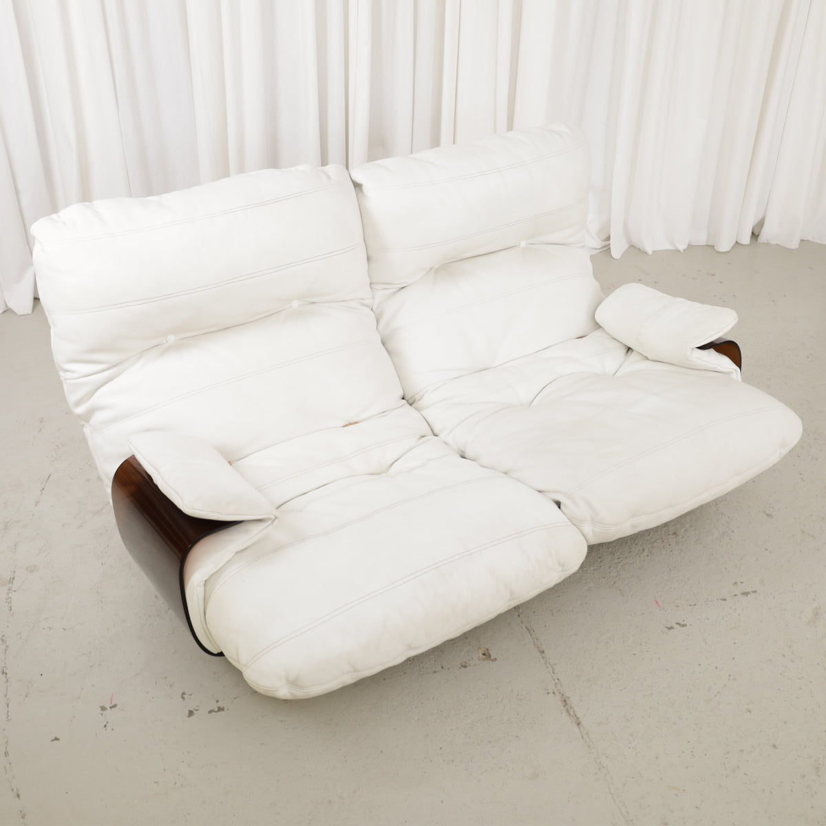 Front angled view of the white two-seater sofa