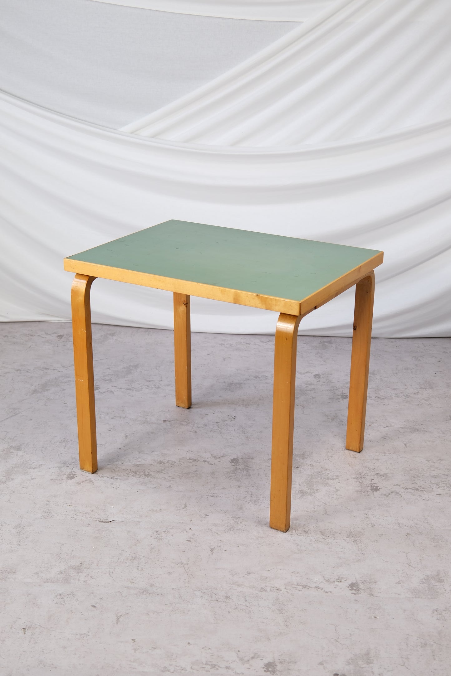 Alvar Aalto vintage table with green linoleum top and birch legs, 1950s Finnish design, 80x60x71 cm.