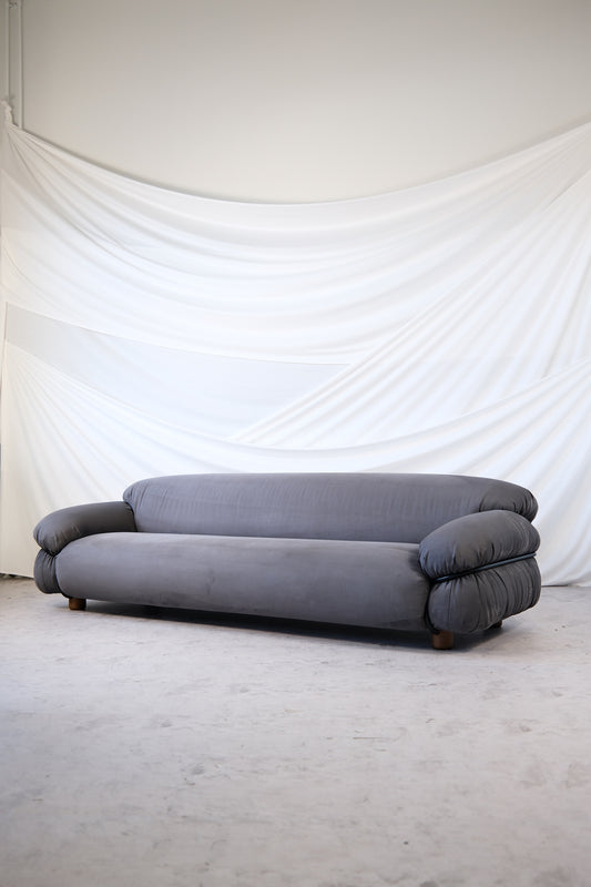 Grey Alcantara Sesann 3-seater sofa by Gianfranco Frattini for Cassina featuring black tubular frame and rounded wooden legs, photographed in neutral studio light.