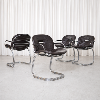 Vintage Sabrina chairs by Gastone Rinaldi for RIMA, Italy, circa 1970. Black leather upholstery with sculptural chrome cantilever frames.